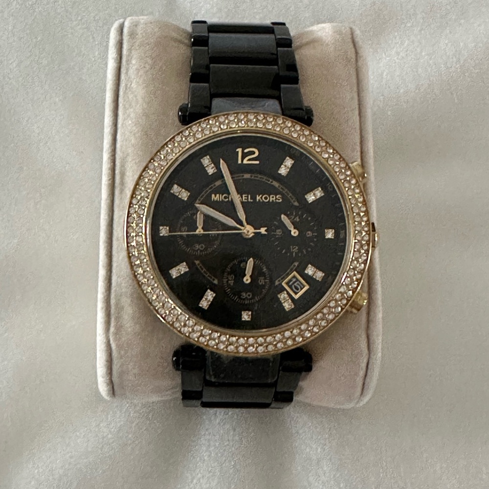 Elegant Black and Gold Watch with Crystal Bezel